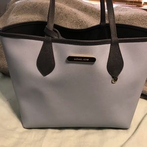 Micheal Kors reversible purse with clutch.